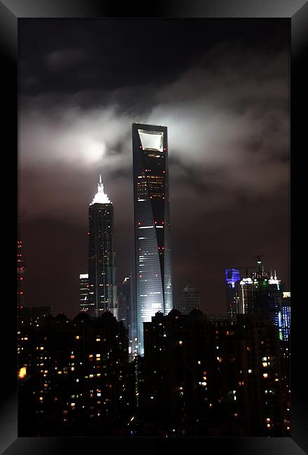 Shanghai in the clouds Framed Print by Jim Leach