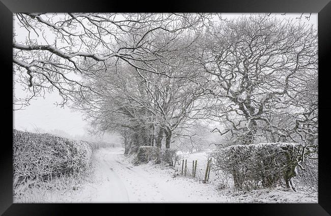  English country lane in the snow Framed Print by Andrew Kearton