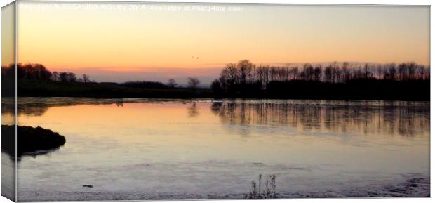 "Sunset across the frozen lake"  Canvas Print by ROS RIDLEY