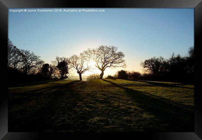 Sunset between two trees Framed Print by Jamie Dumbleton