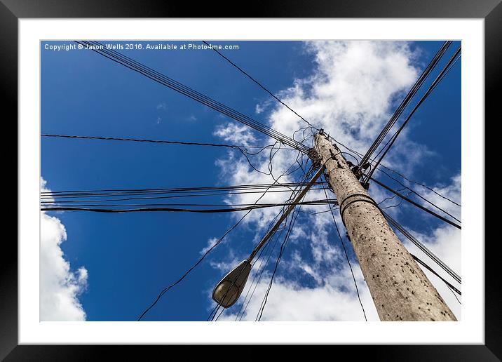 Looking up at a chaotic telegraph pole Framed Mounted Print by Jason Wells