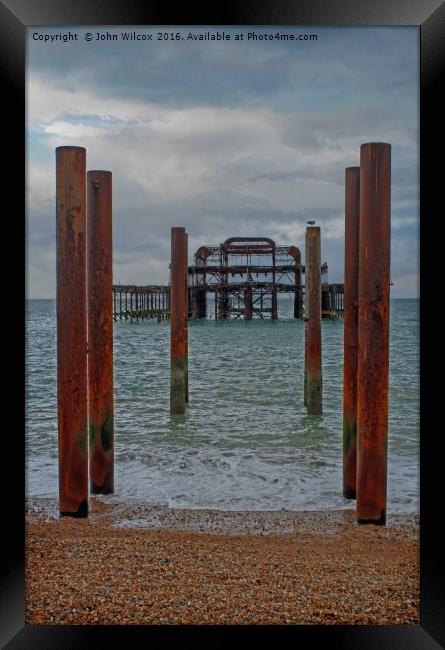 Old Pier in Brighton Framed Print by John Wilcox