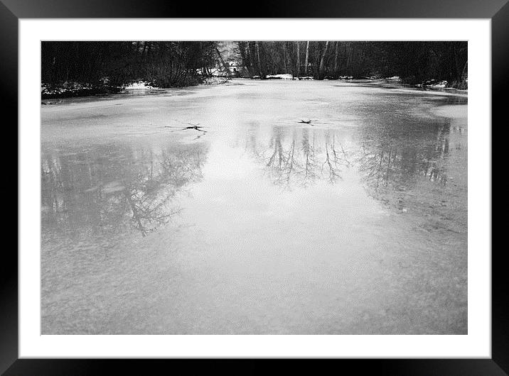 Reflections on a frozen lake. Norfolk, UK. Framed Mounted Print by Liam Grant