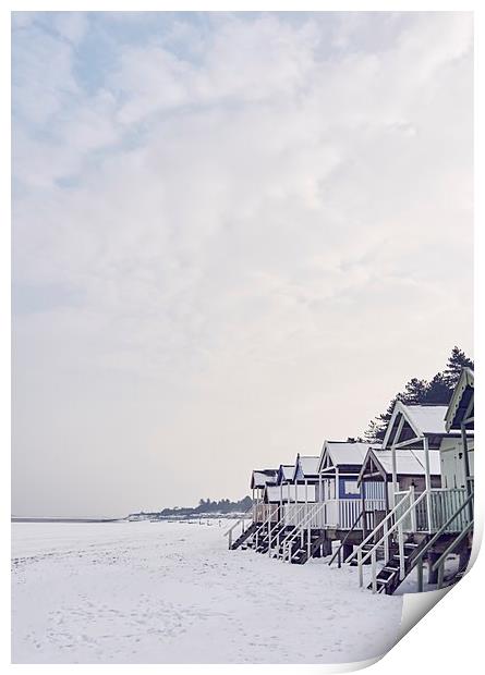 Beach huts covered in snow at low tide. Wells-next Print by Liam Grant