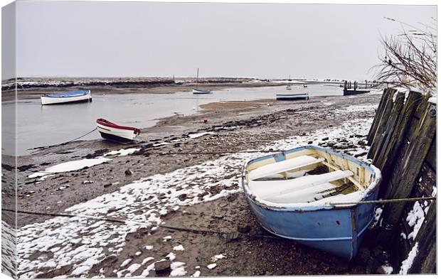 Boats and snow at low tide. Burnham Overy Staithe, Canvas Print by Liam Grant