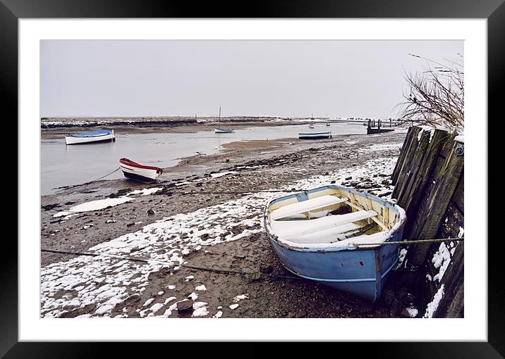 Boats and snow at low tide. Burnham Overy Staithe, Framed Mounted Print by Liam Grant