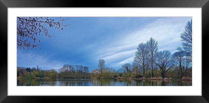  Looking over the lake up at the blue sky          Framed Mounted Print by Sue Bottomley