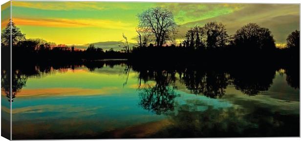  Colourful Sunrise over the lake                   Canvas Print by Sue Bottomley