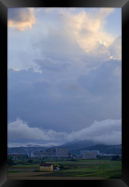 Storm clouds gather over Ljubljana, Slovenia Framed Print by Ian Middleton