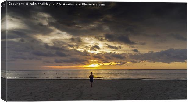 Walking On The Beach At Sunset Canvas Print by colin chalkley