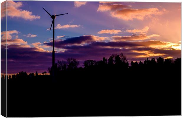 small wind turbine in silhouette at sunrise Canvas Print by craig baggaley