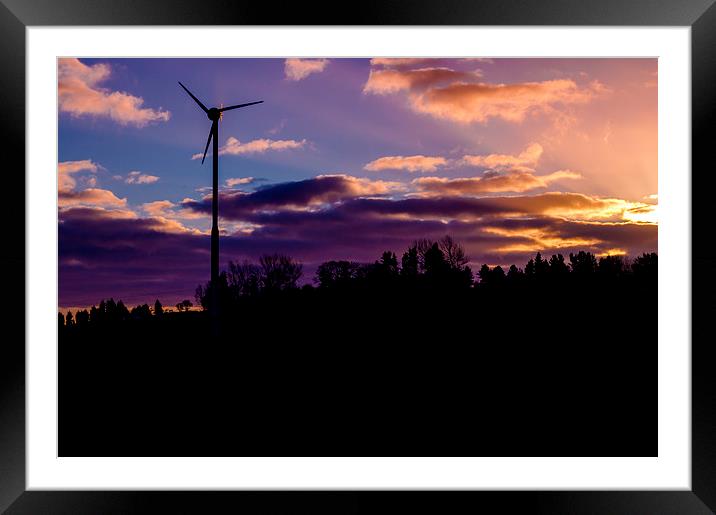small wind turbine in silhouette at sunrise Framed Mounted Print by craig baggaley