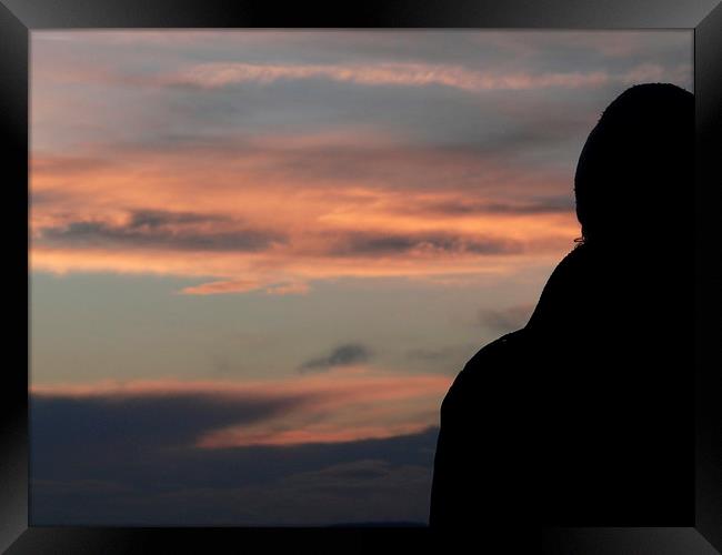Silhouette of A man enjoying the sunset sky Framed Print by Jackson Photography