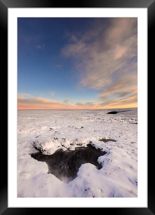 Icy pool on the snowy moors at dusk Framed Mounted Print by Andrew Kearton