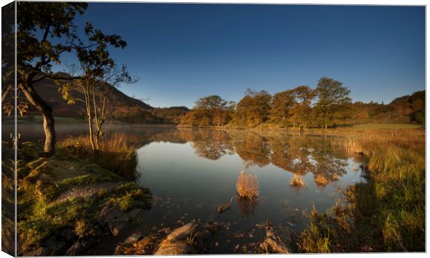 Reflections on Rydal water on an autumn dawn Canvas Print by Eddie John