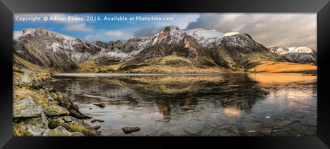 Frozen Idwal Lake Snowdonia  Framed Print by Adrian Evans