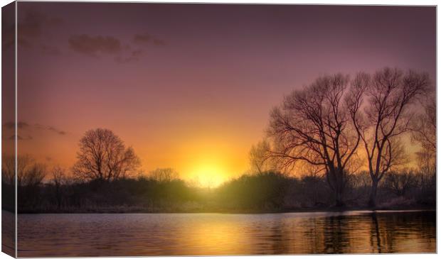 Sunset over water. Canvas Print by John Allsop
