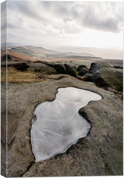 Frozen puddle on Stanage Edge at sunset. Derbyshir Canvas Print by Liam Grant