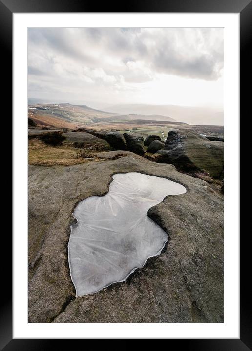 Frozen puddle on Stanage Edge at sunset. Derbyshir Framed Mounted Print by Liam Grant