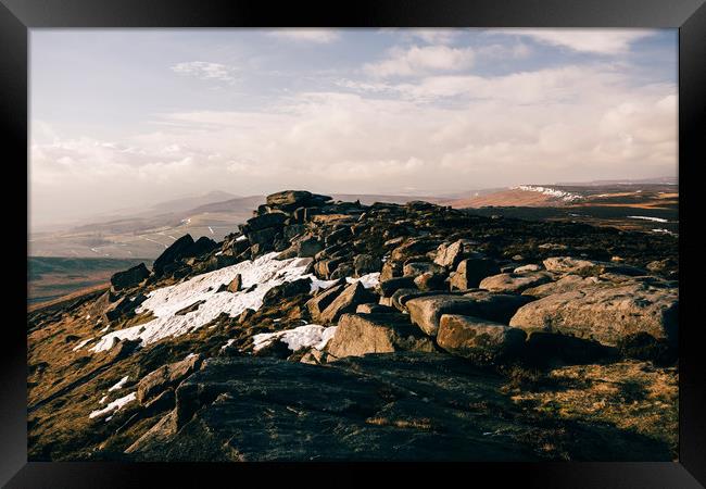 Snow on Stanage Edge at sunset. Derbyshire, UK. Framed Print by Liam Grant