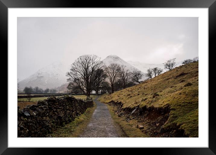 Snow blizzard and footpath to a remote cottage. Cu Framed Mounted Print by Liam Grant