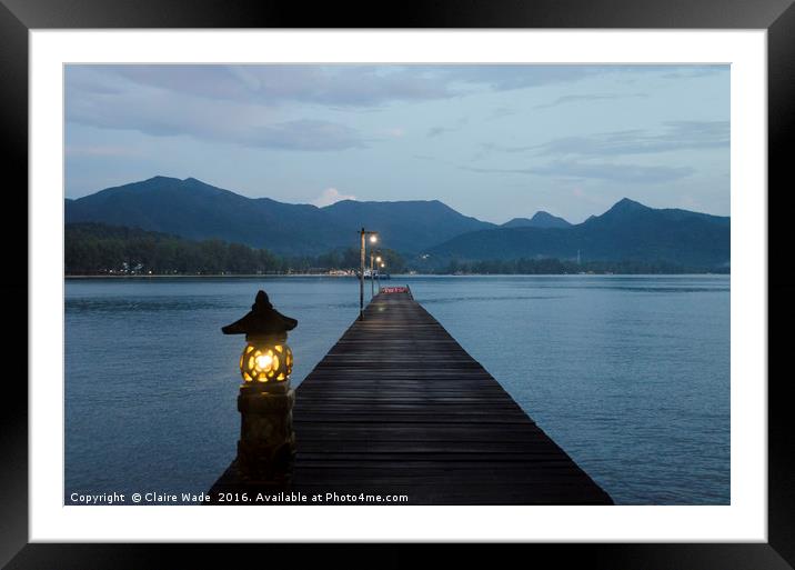 Dusk over jetty in Thailand Framed Mounted Print by Claire Wade