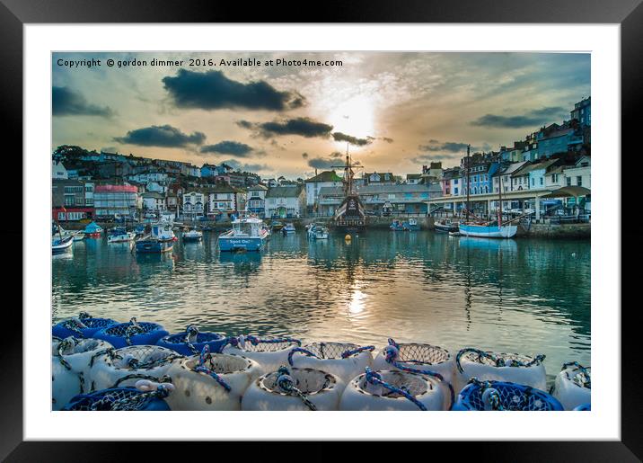 Brixham Harbour with a Setting Sun Framed Mounted Print by Gordon Dimmer