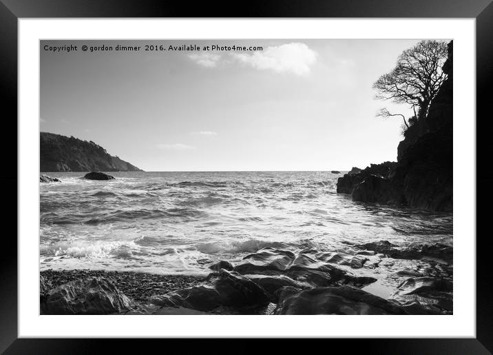 A black and white image of Castle Cove near Dartmo Framed Mounted Print by Gordon Dimmer