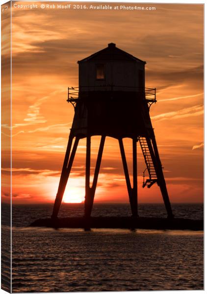 Dovercourt Leading Light in Silhouette. Canvas Print by Rob Woolf