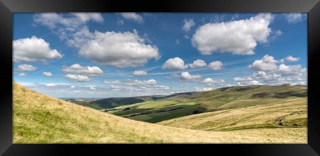 Fluffy clouds over the hills Framed Print by Andrew Kearton