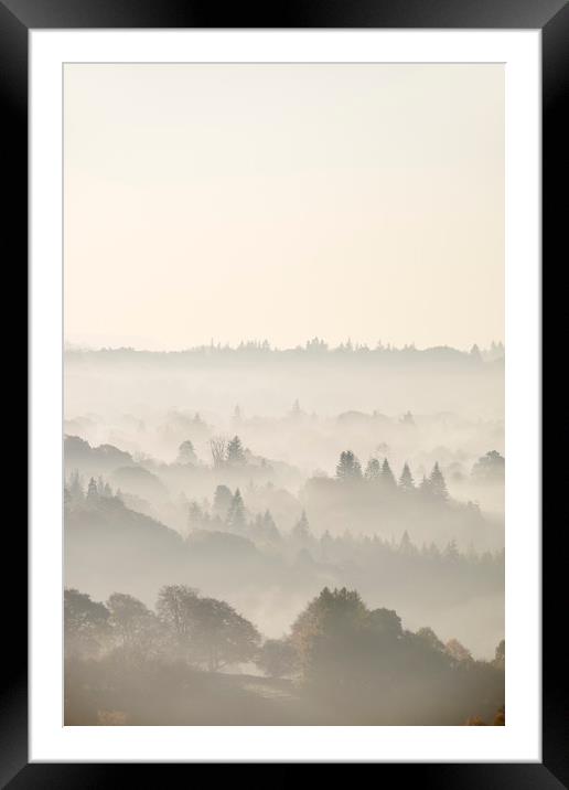 Layers of fog in the valley at sunrise. Troutbeck, Framed Mounted Print by Liam Grant