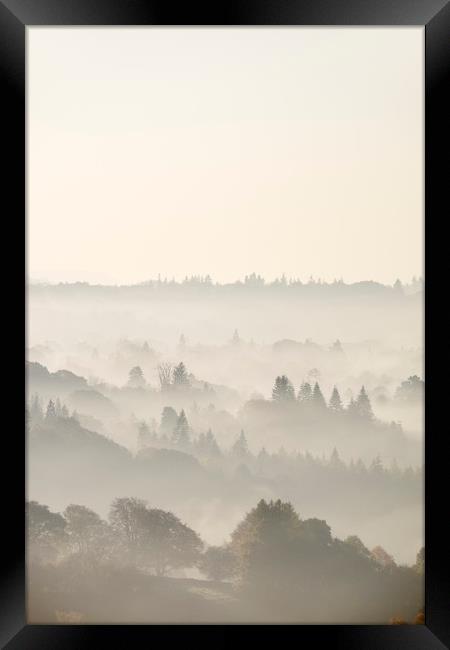 Layers of fog in the valley at sunrise. Troutbeck, Framed Print by Liam Grant