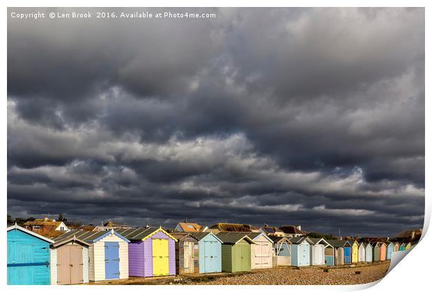 Ferring Beach Huts Under a Brooding Sky Print by Len Brook