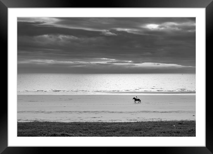 Beach jockey Framed Mounted Print by Gary Finnigan