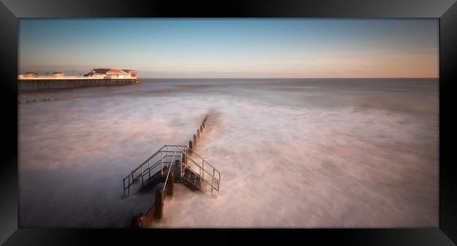 Cromer Pier Sunrise Framed Print by Simon Wrigglesworth