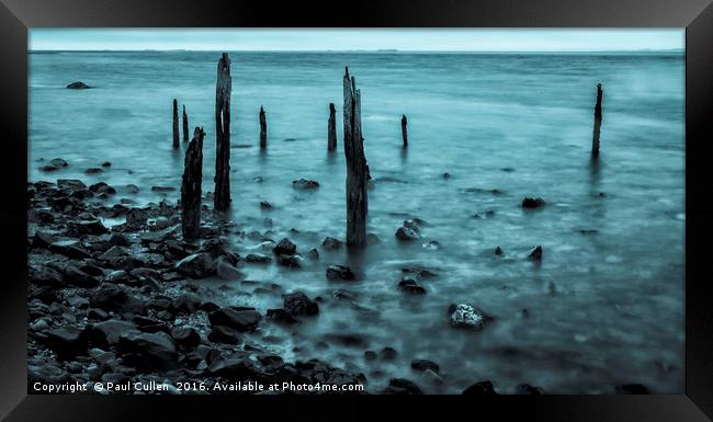 Old posts at Lindisfarne in Cyan. Framed Print by Paul Cullen
