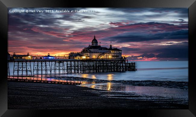 Sunrise Over The Pier Framed Print by Neil Vary