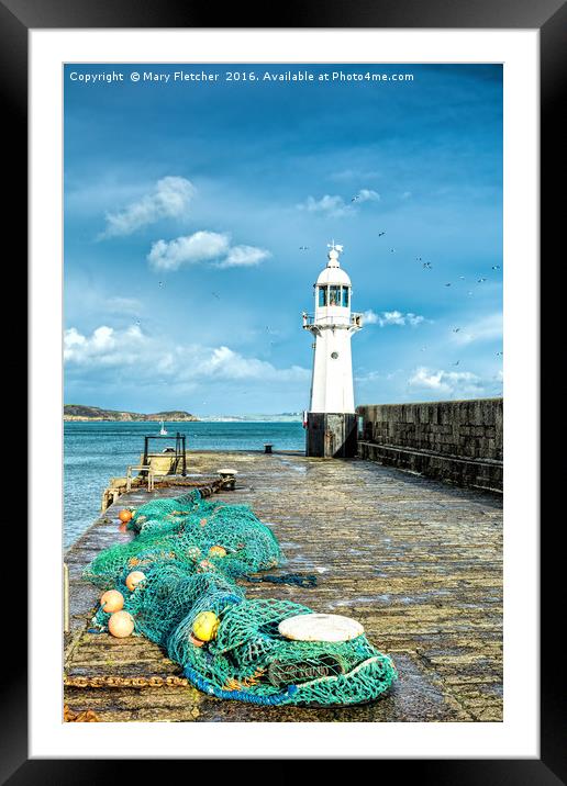 Nets and Lighthouse Framed Mounted Print by Mary Fletcher