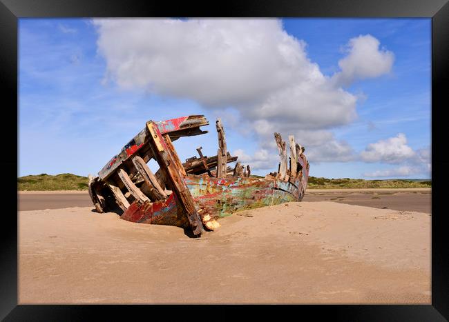 Fishing boat wrecked on the sand Framed Print by Shaun Jacobs