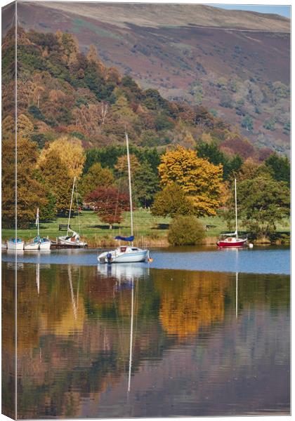 Boats and autumnal colour. Ullswater, Cumbria, UK. Canvas Print by Liam Grant