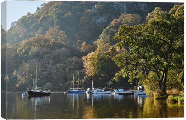Boats and autumnal colour. Ullswater, Cumbria, UK. Canvas Print by Liam Grant