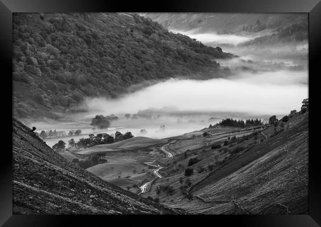 Fog formed in the valley at sunrise. Kirkstone Pas Framed Print by Liam Grant
