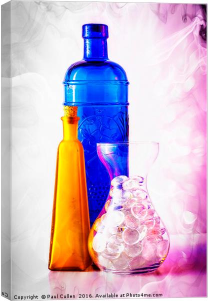Colourful jars and bottles with glass pebbles. Canvas Print by Paul Cullen