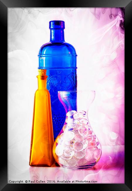 Colourful jars and bottles with glass pebbles. Framed Print by Paul Cullen