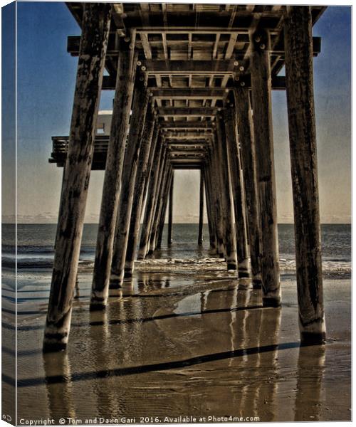 Under The Pier Canvas Print by Tom and Dawn Gari