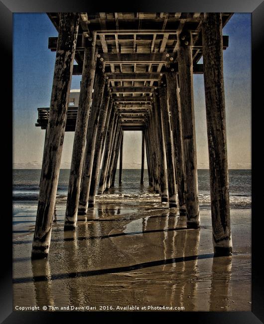 Under The Pier Framed Print by Tom and Dawn Gari