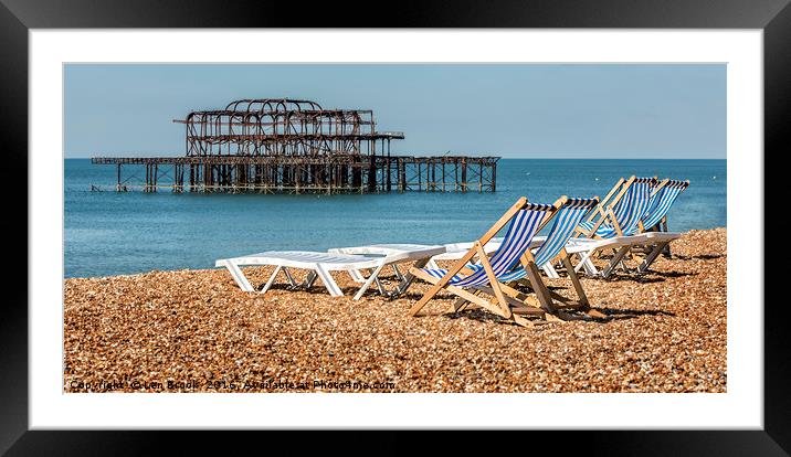 Brighton Beach West Pier Deckchairs. Framed Mounted Print by Len Brook