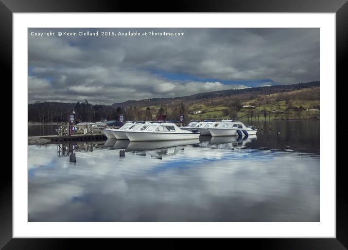 Boats anchored at Coniston Lake Framed Mounted Print by Kevin Clelland