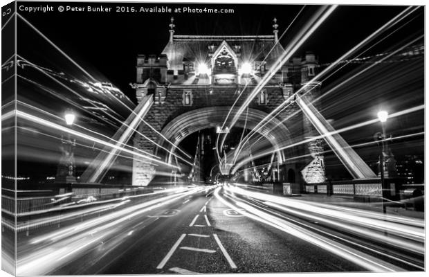 Light Trails in Monochrome. Canvas Print by Peter Bunker
