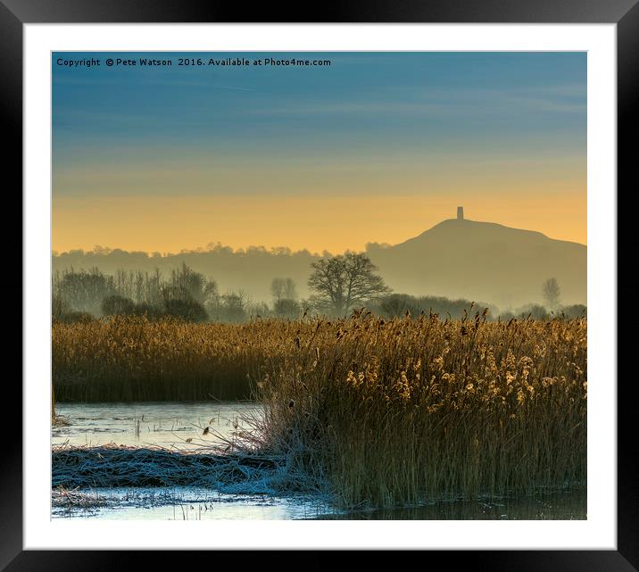 Glastonbury Tor shrouded in early morning mist. Framed Mounted Print by Pete Watson